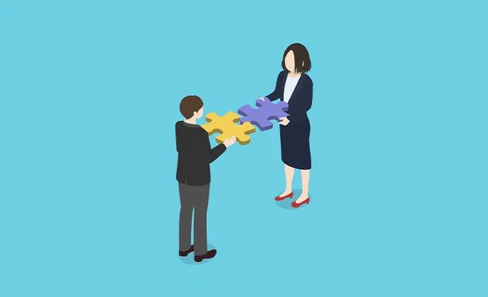 パズルのピースを合わせる人々