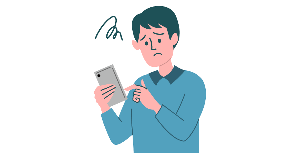 スマートフォンを見て困っている男性
